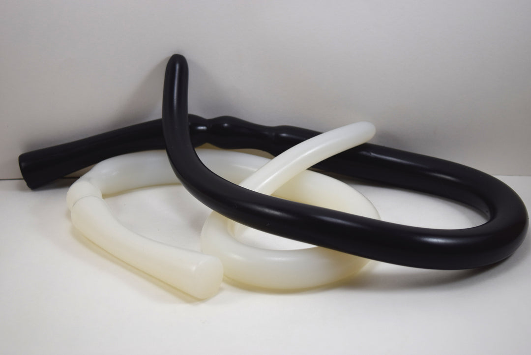The Needle 31-inch slender silicone enema nozzle featuring a smooth, graduated design and extended retention valley on a white background