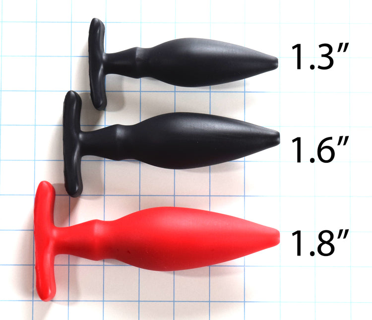 Comparison of OF Series silicone enema nozzles in 1.3-inch, 1.6-inch, and 1.8-inch sizes displaying contoured oval base flanges.