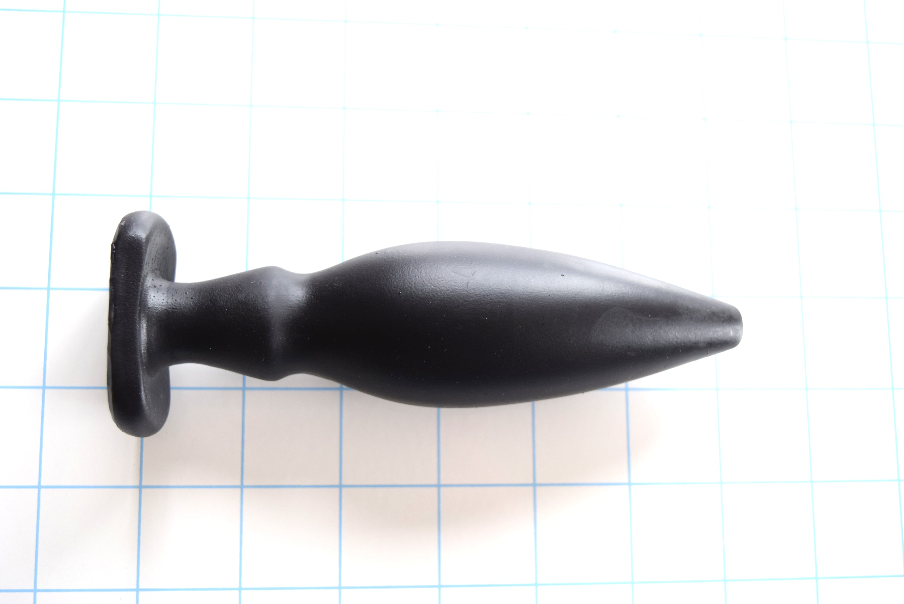 6-inch oval flange-style silicone enema nozzle with 1.6-inch maximum diameter, dual retention valleys, contoured flange, 5.5-inch insertable length