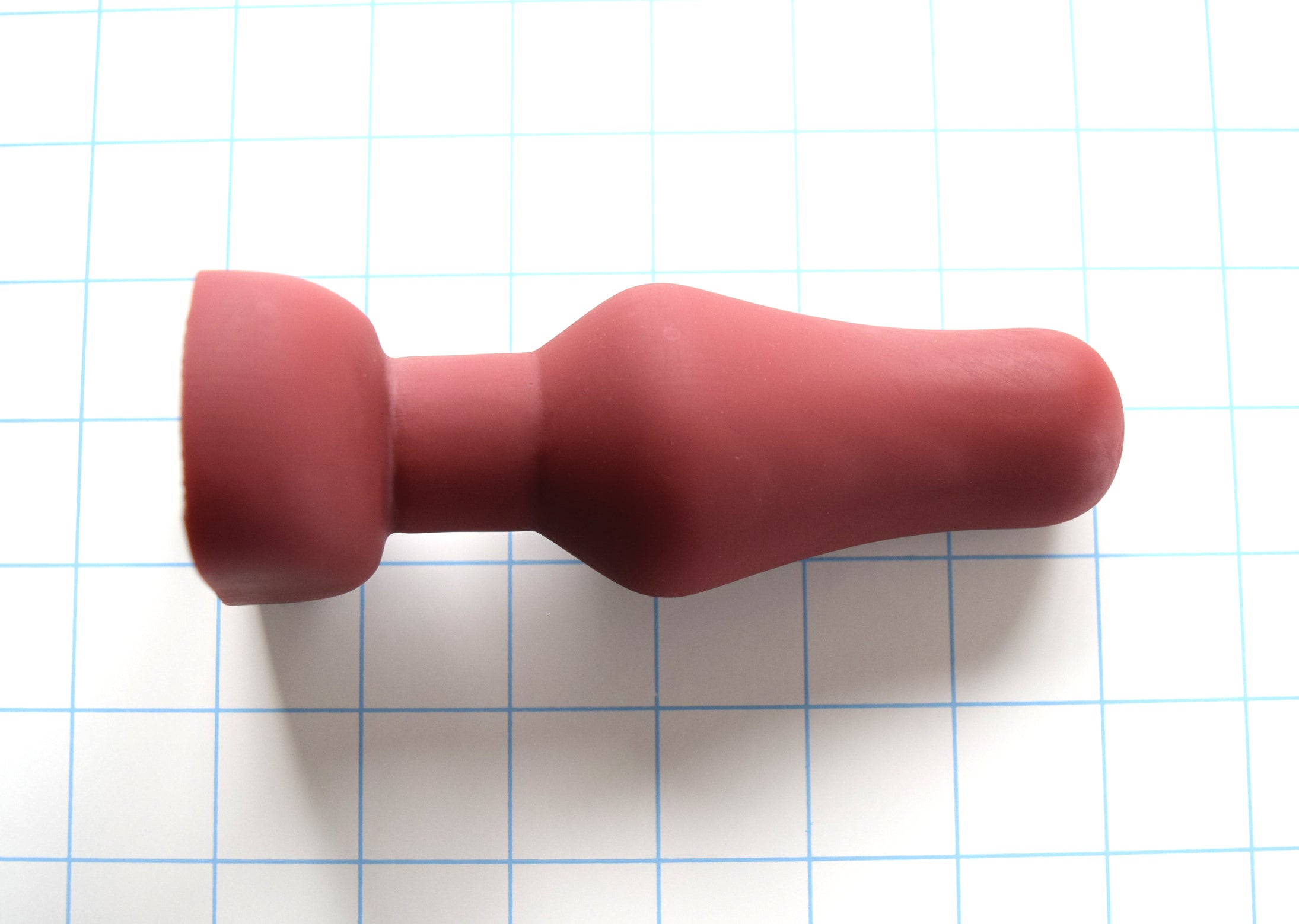 6-inch oval flange-style silicone enema nozzle with 1.9-inch maximum diameter swell, contoured oval flange, 4.5-inch insertable length