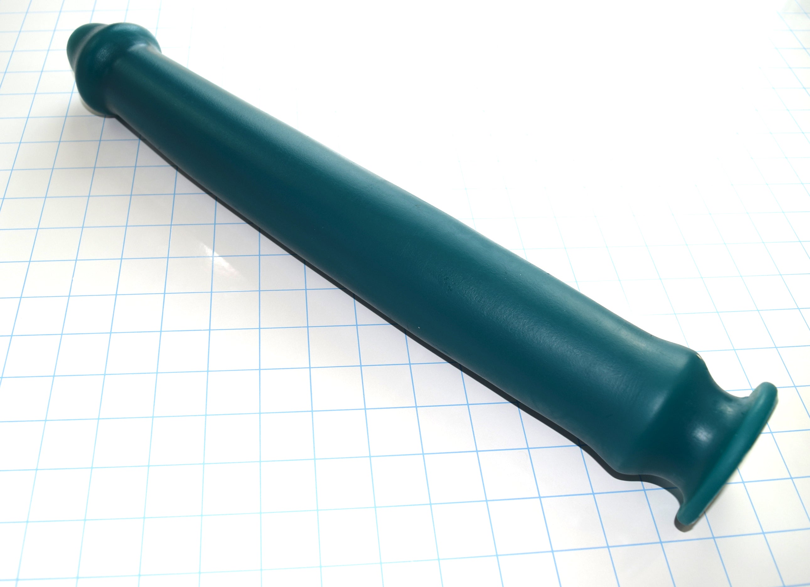 Priapus 18-inch large silicone enema nozzle featuring a 17-inch insertable length, 2.5-inch maximum shaft diameter, and safety retention flange on a blue grid background.
