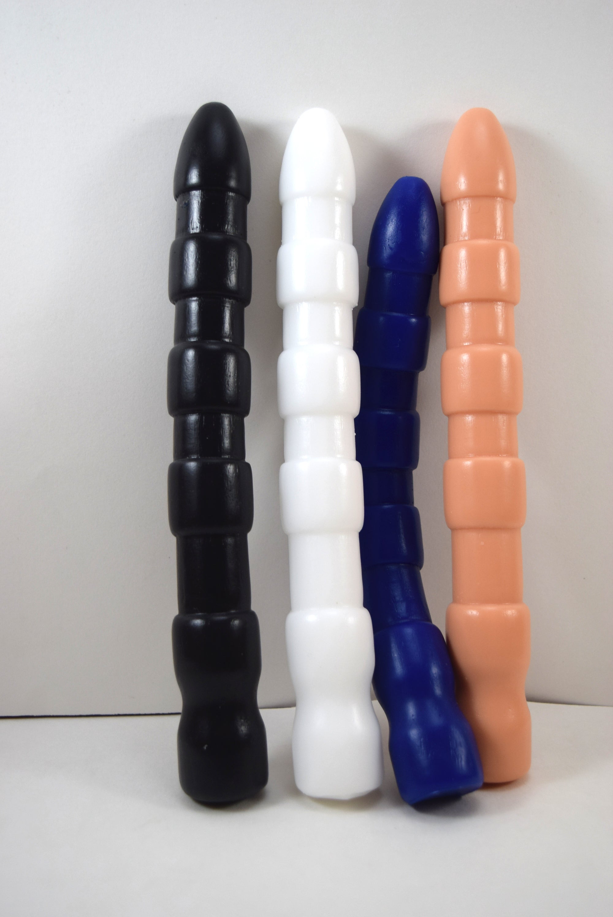 Ribbed Shooter 9 inch textured silicone enema nozzle featuring heavy gauge 28mm ribs, 26mm bulbous tip, and retention flange.