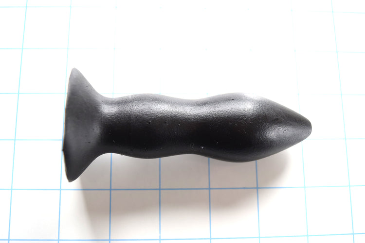 RTDL 1.3 black silicone rectal training dilator nozzle showcasing its 4.5-inch total length, 1.3-inch tapering ellipse tip, dual retention bulbs, and 1.75-inch safety base flange on a blue grid background