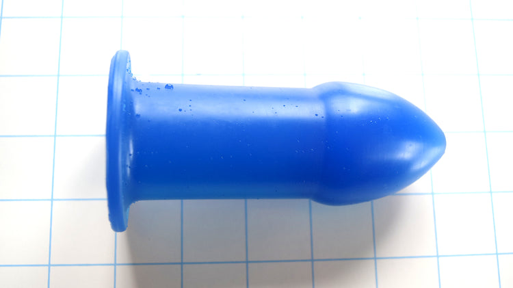 Silicone enema dilator with 1.75 inch tip tapering to 1.5 inch shaft and 2.25 inch flange