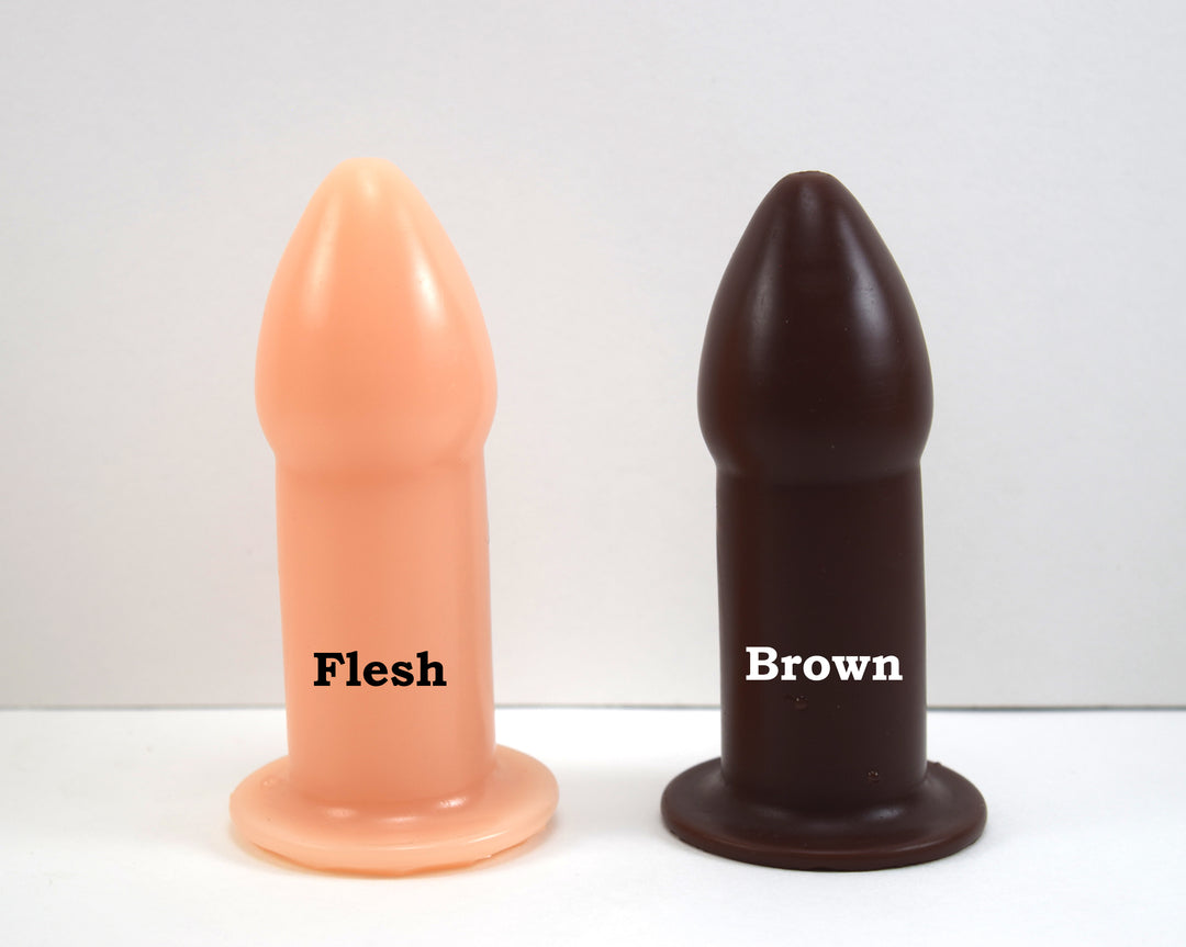Flesh-toned and brown silicone rectal training dilators standing side-by-side on a white surface with text overlay.