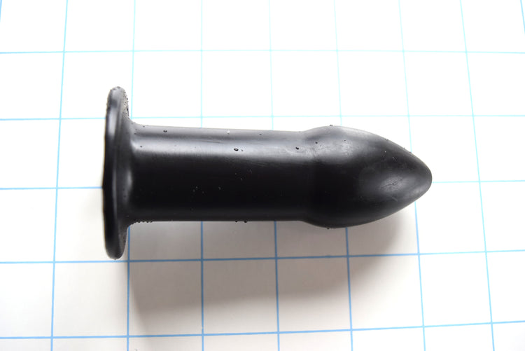 RTDL 1.25 inch rectal training dilator in medical-grade platinum silicone with tapered tip, retention flange, and open bore design