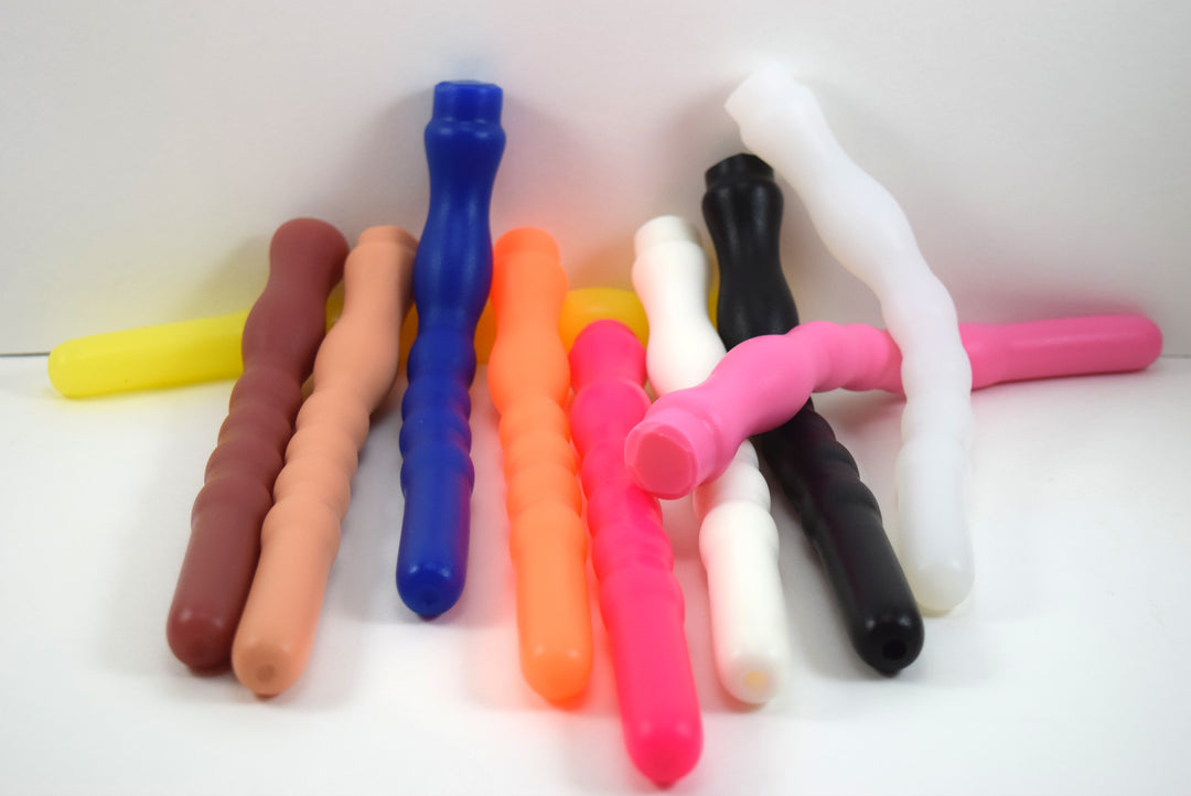 Assortment of colorful 9-inch Shower Shooter silicone enema nozzles featuring a smooth 0.75-inch tip, modulated expansion ribs, and retention valley.