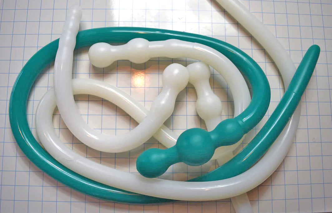 An assortment of silicone colon tubes and products displayed together on the products overview page.
