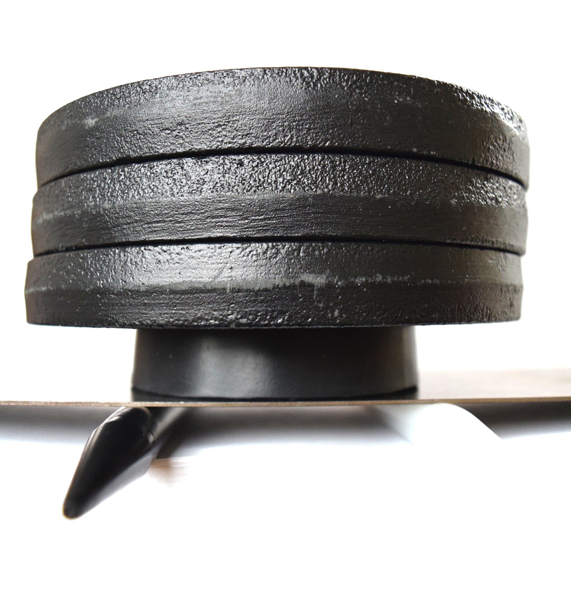 15 lb weight compression test on a 10 firmness silicone tube under a flat steel plate.