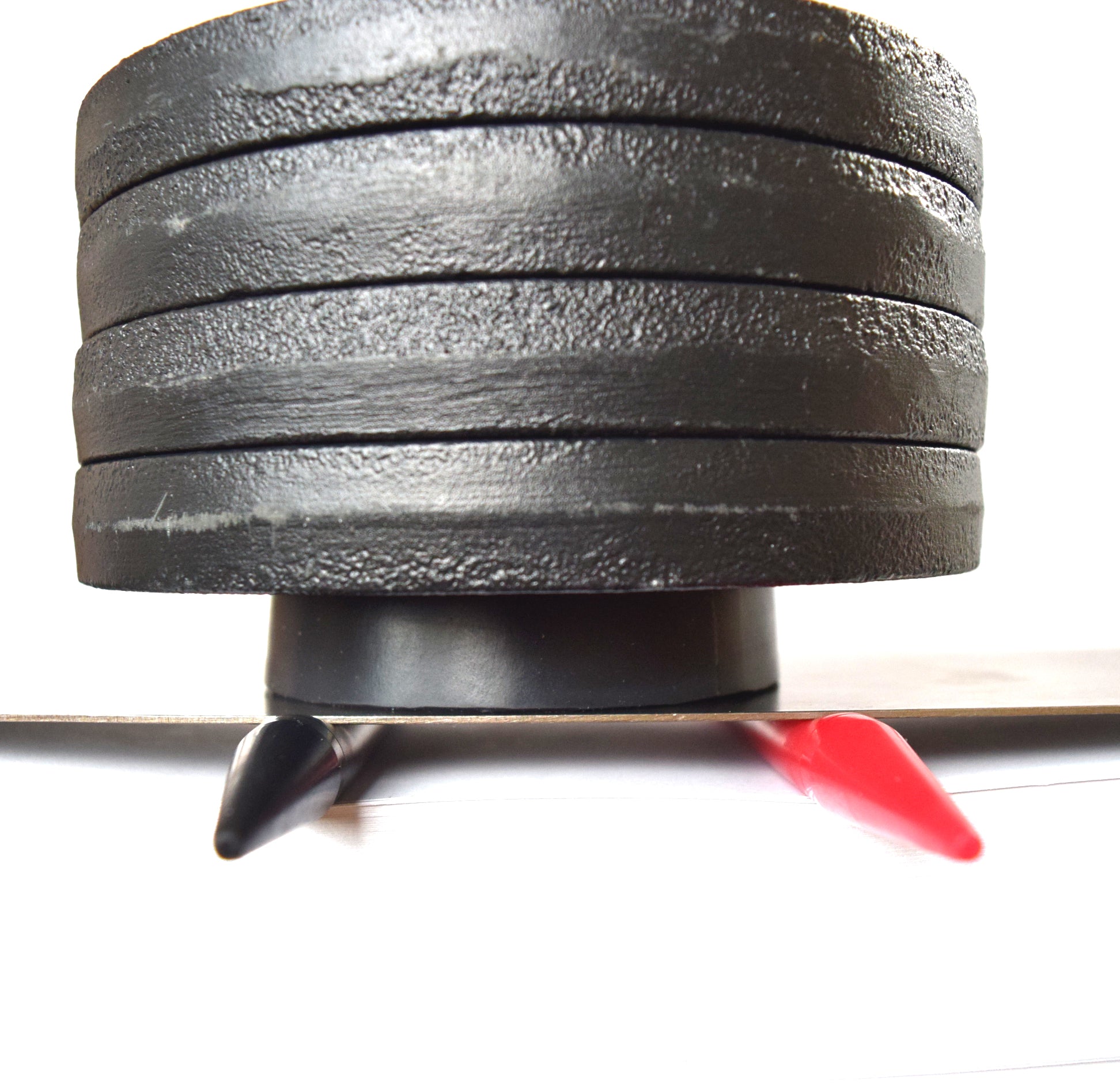 20 lb weight compression test on a 00-50 firmness silicone tube under a flat steel plate.