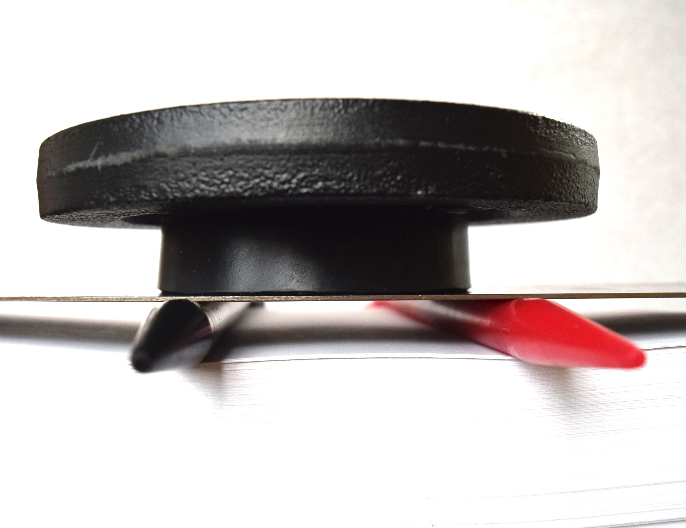 5 lb weight compression test on a 00-50 firmness silicone tube under a flat steel plate.