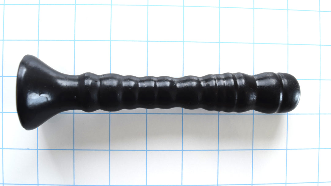 Small Ribbed Shaft black silicone multi-purpose enema nozzle showcasing its 6-inch insertable length, 10 alternating textured ribs, tapered 7/8-inch mid-shaft, and 1.875-inch trumpet safety base on a grid background