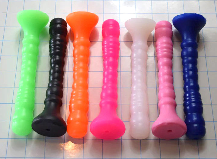Seven Small Ribbed Shaft silicone enema nozzles lined up on grid paper displaying trumpet bases and 10-rib shaft profiles.