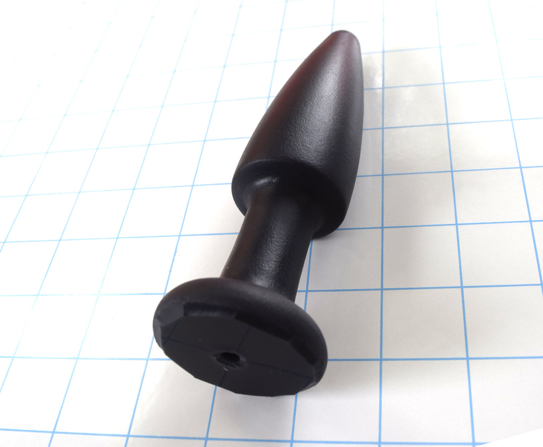 SPD1.5 medium retention style silicone nozzle with 5-inch tapered tip, 1.5-inch maximum diameter, and safety retaining flange