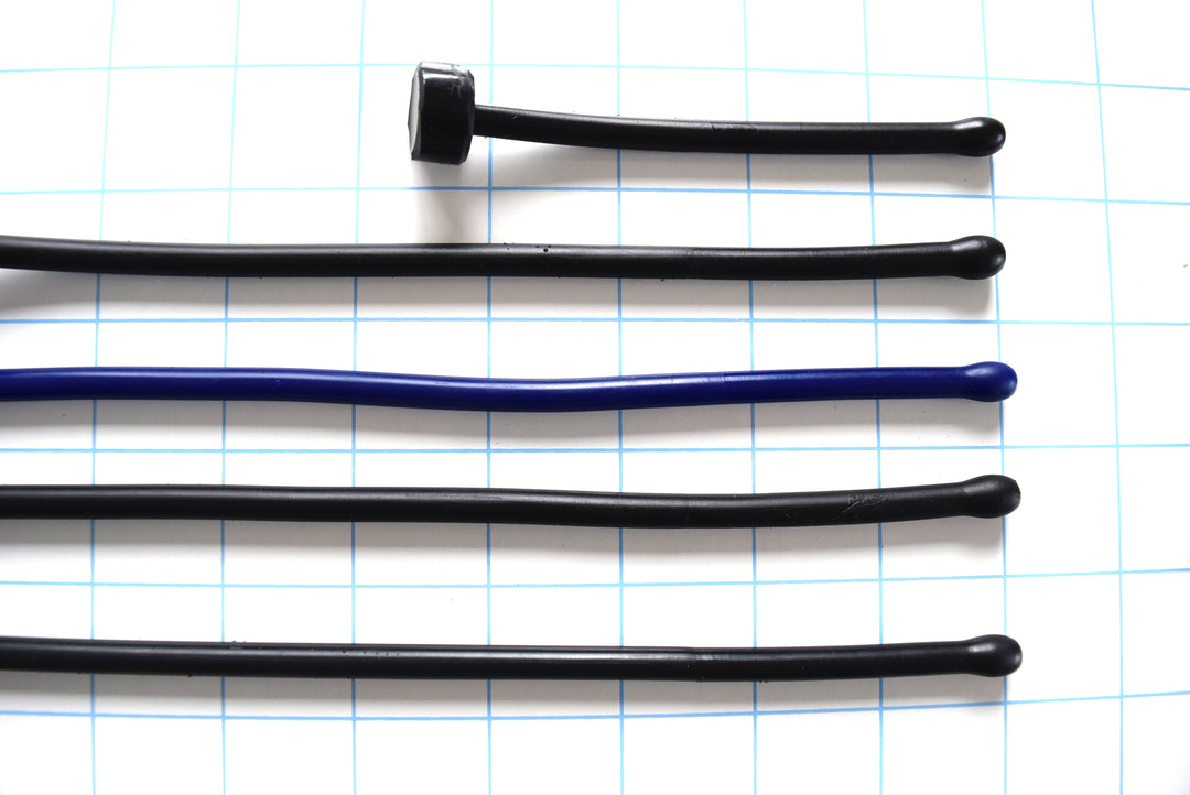 SSND-6.5BT expanded ball tip silicone urethral sounds displayed in black and blue color variants across multiple length options on a grid background, showing the 7.5mm rounded oval tips, slim 6.5mm uniform shafts, and flat safety base flanges.
