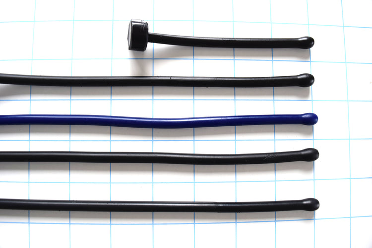 SSND-6.5BT expanded ball tip silicone urethral sounds displayed in black and blue color variants across multiple length options on a grid background, showing the 7.5mm rounded oval tips, slim 6.5mm uniform shafts, and flat safety base flanges.