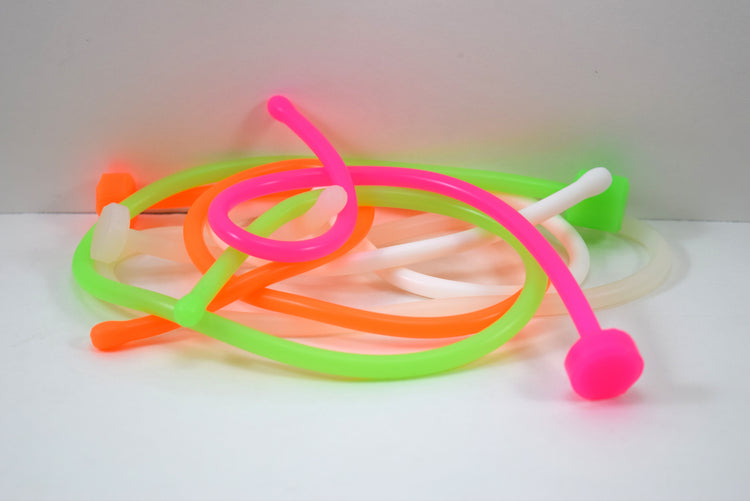 SSND-6.5BT translucent white silicone urethral sound featuring a 7.5mm rounded oval tip, slim 6.5mm uniform shaft, flat safety base flange, and solid construction on a grid background.