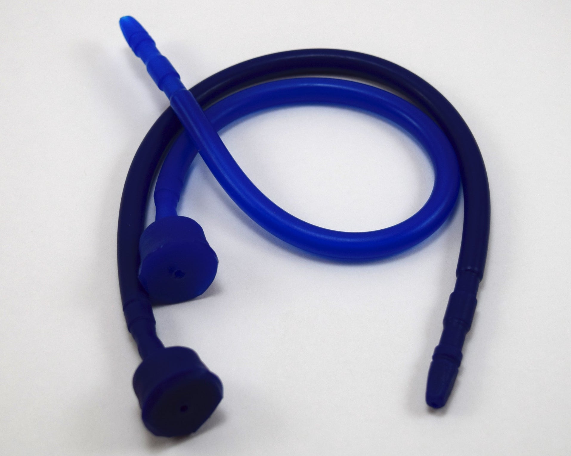 Two 13-inch contoured silicone sounds in royal blue and dark blue curled into loops on a plain white surface.