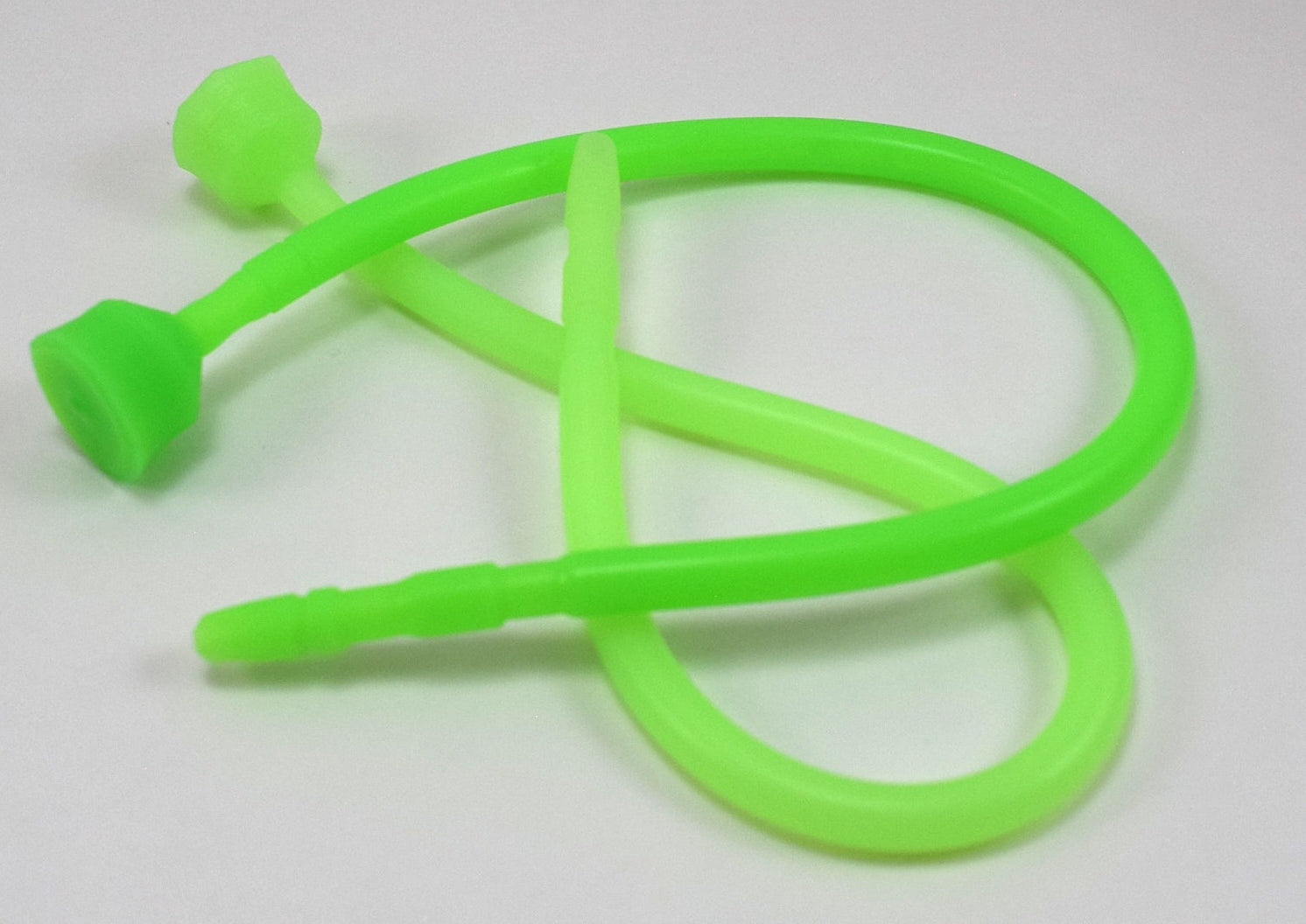 Two fluorescent green 13-inch contoured silicone sounds curled into loops on a plain white background.