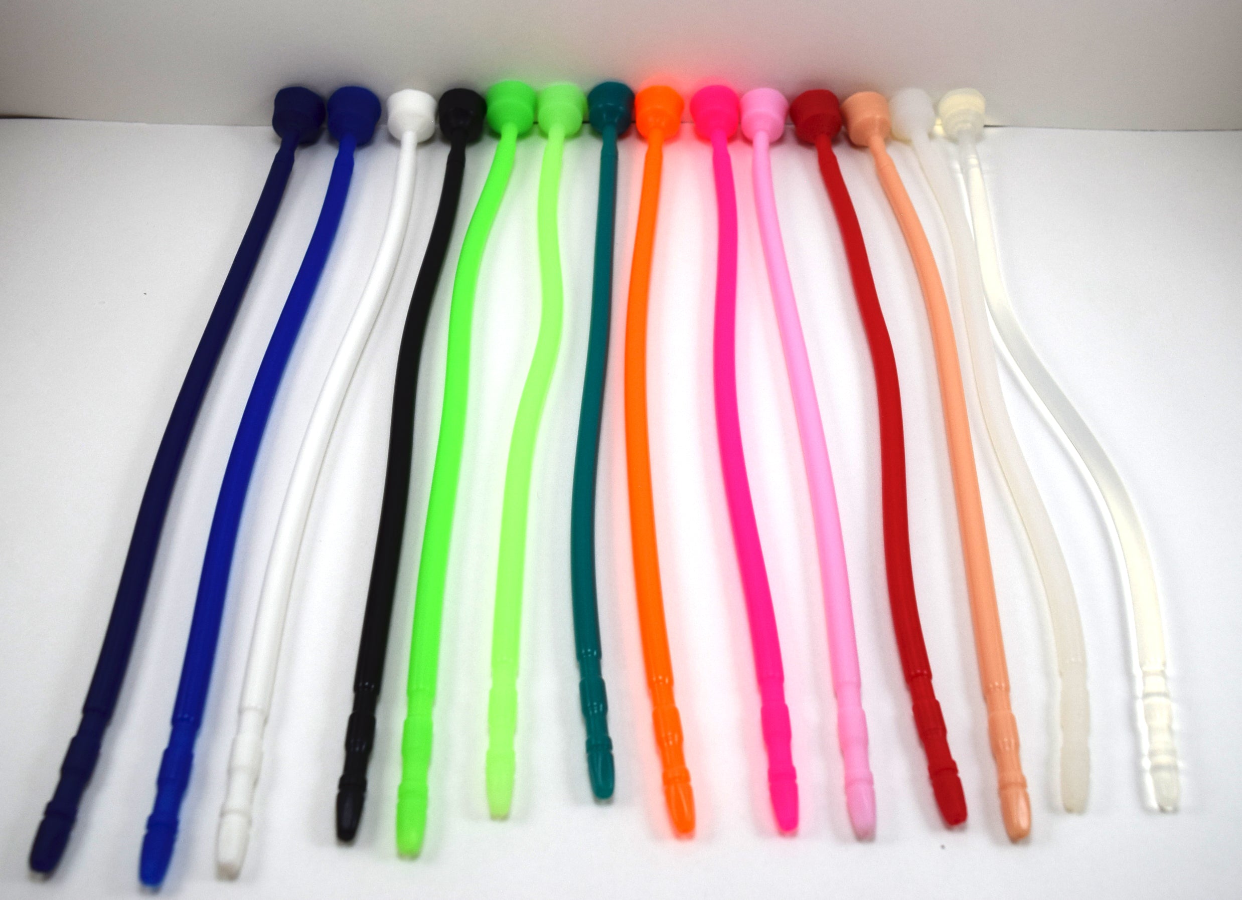 A colorful line-up of 13-inch contoured silicone sounds arranged vertically side-by-side on a white surface.
