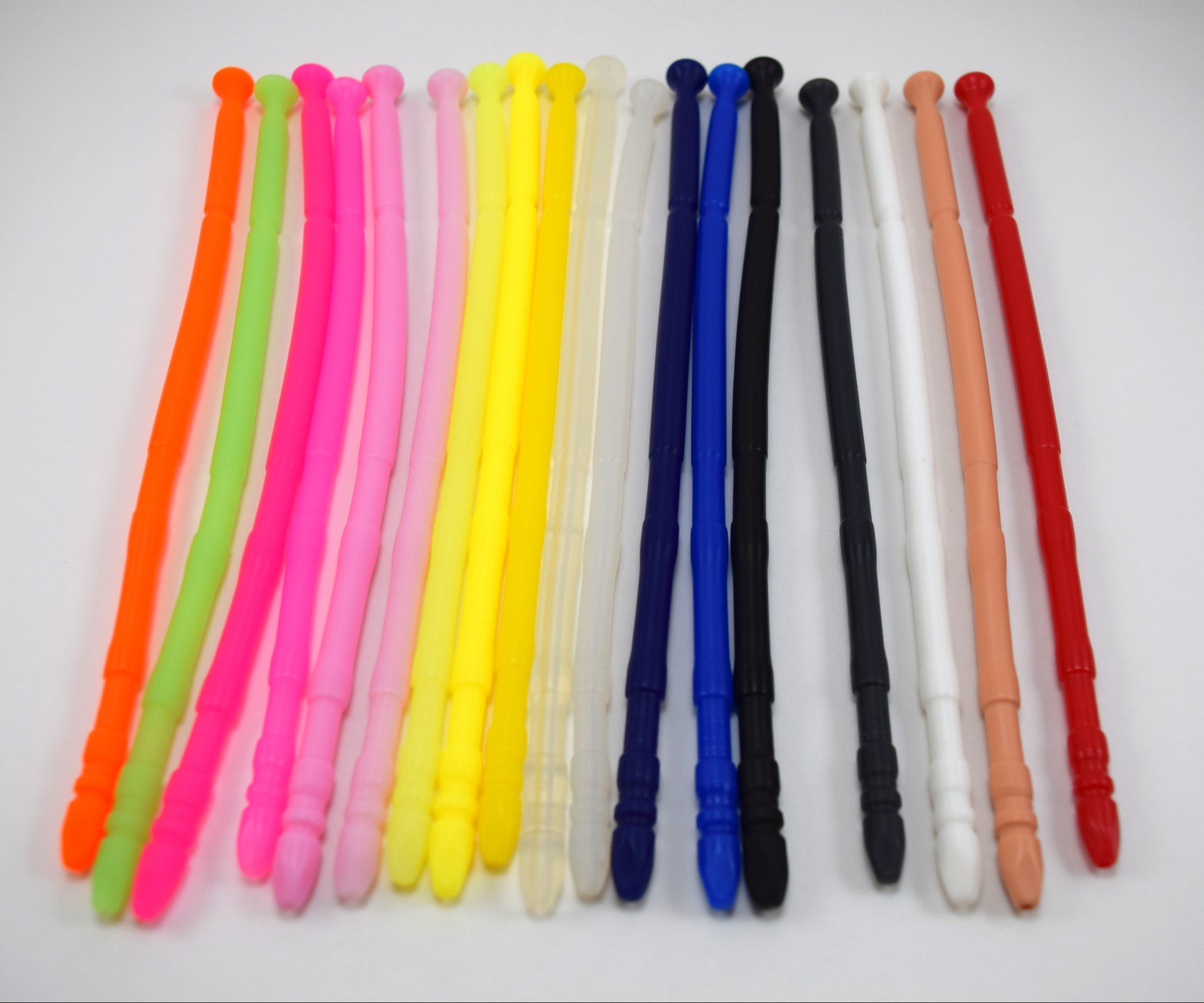 A colorful array of 13-inch contoured silicone sounds lined up vertically side by side on a plain white background.