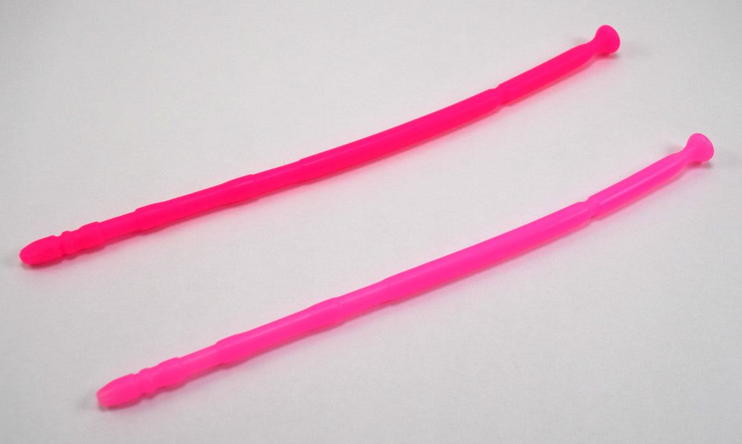 Two bright pink 13-inch contoured silicone sounds with multi-faceted tips laid parallel on a plain white background.