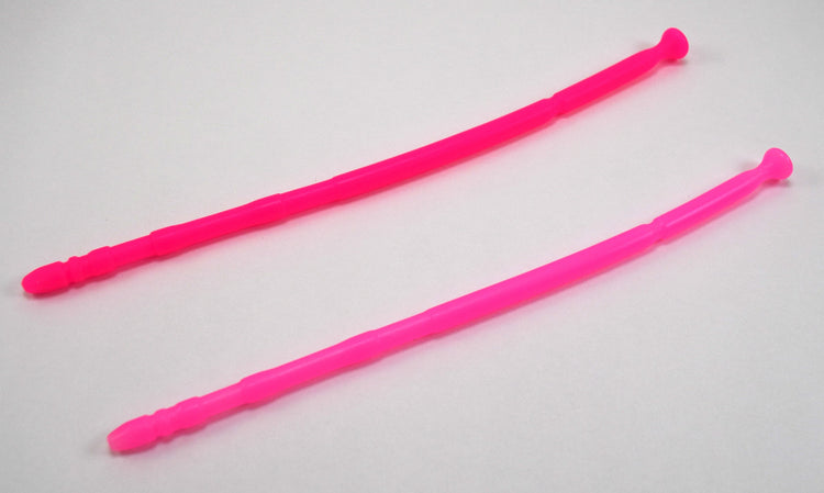 Two bright pink 13-inch contoured silicone sounds with multi-faceted tips laid parallel on a plain white background.