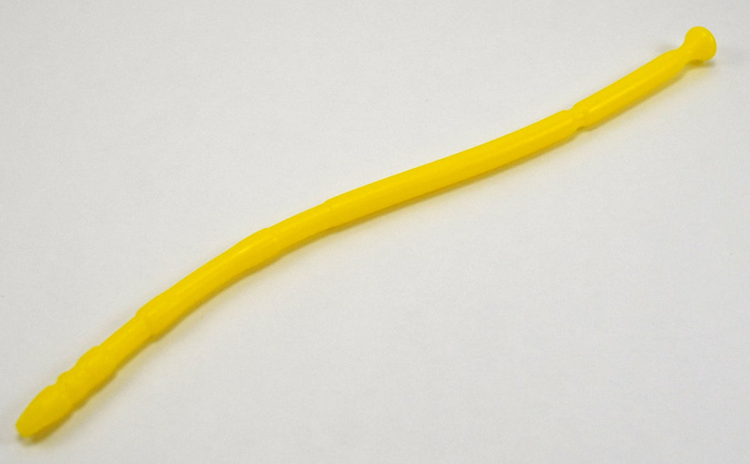 A yellow 13-inch contoured silicone sound with a multi-faceted tip lying diagonally on a plain white background.