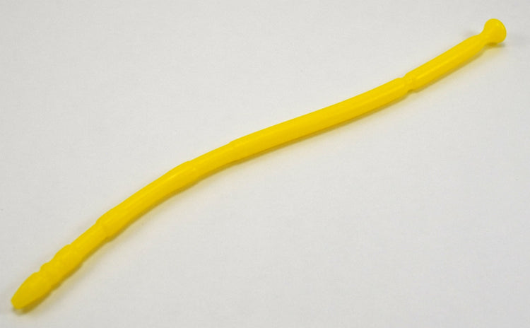 A yellow 13-inch contoured silicone sound with a multi-faceted tip lying diagonally on a plain white background.