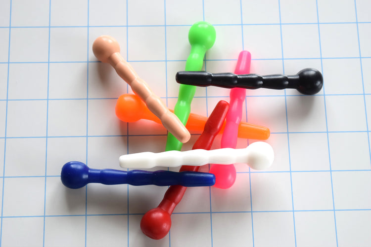 SSND-CNTRD3 short contoured silicone sounds arranged on grid background showing 7mm tip, 9.5mm swells, 8mm retention valley, and ball flange base.