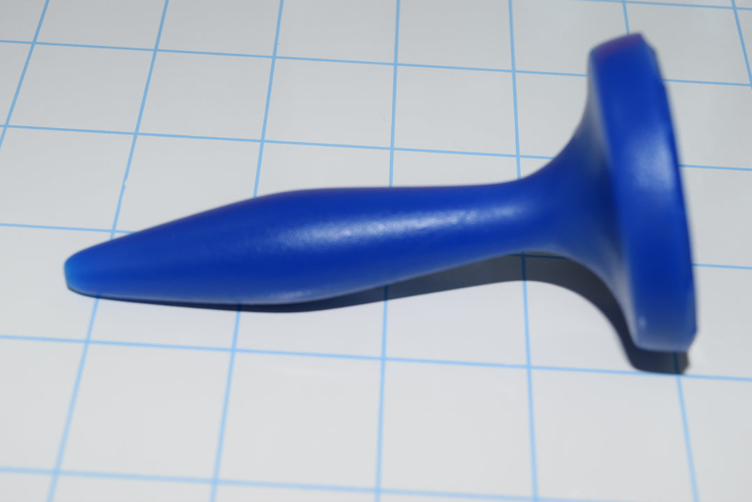 SSND-Diamond 12-19 blue silicone plug showing 7mm diamond tip, 19mm center swell, narrow neck, and wide flared safety flange.