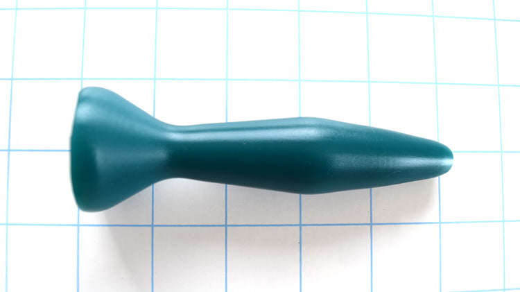SSND-Diamond 8-25 BF silicone urethral sound featuring an 8mm soft rounded tip, 25mm maximum diameter center, 17mm retention valley, 1.3-inch ball flange, and 4-inch insertable length on a grid background.
