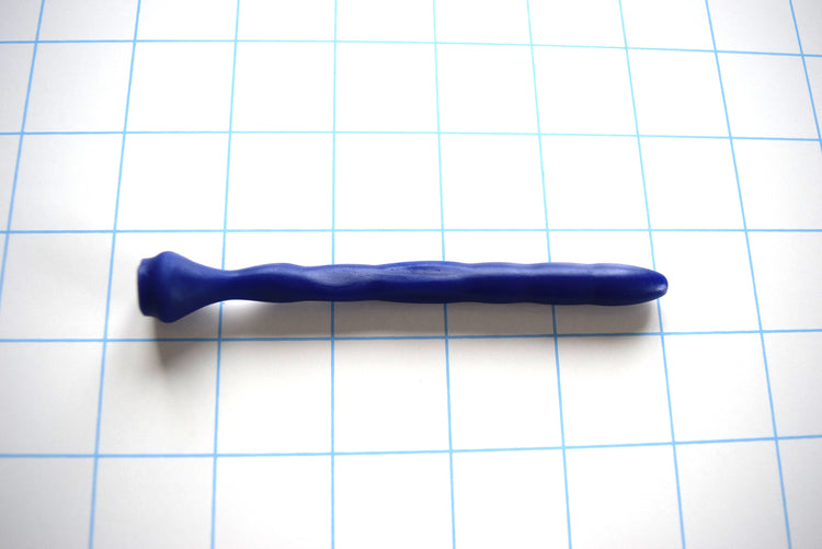 SSND-Dimpled short flexible silicone urethral sound shown in blue on a grid background, highlighting its 5mm rounded tip, 9.25mm dimpled textured shaft, and a narrow 4.75mm flattened billow section leading to a 14.5mm safety base flange.