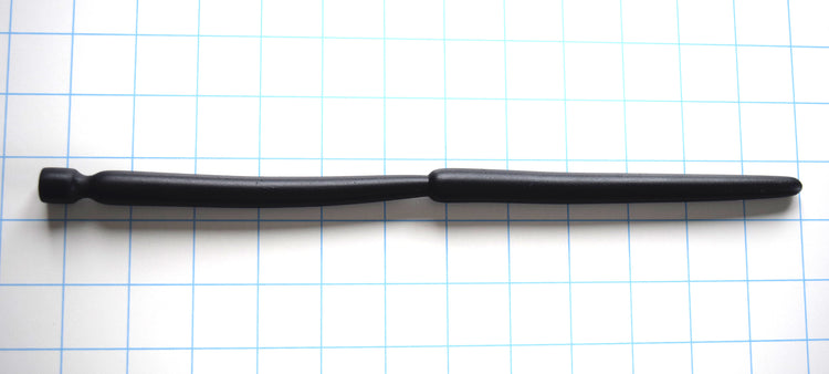 SSND-Double Expansion 12-inch advanced silicone urethral sound resting on a blue grid background, showcasing its dual 14mm and 13.7mm expansion nodes, 9mm tapered tip, and flared safety base.