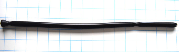 Black SSND-DS 9-12 silicone sound featuring a grooved tip, 12mm shaft, and flanged safety base laid horizontally on a blue grid background.