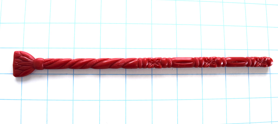 SSND-FLORENTINE10 silicone urethral sound featuring an elliptical rounded tip, alternating florettes, barrel sections, ribs, twisted rope texture, retaining ball, flat 21mm safety flange, and 9.25-inch insertable length on a grid background.