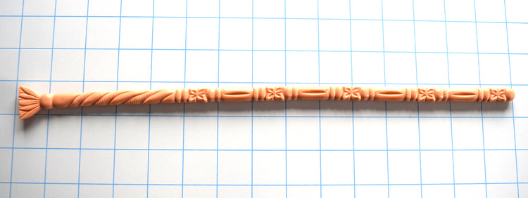 flesh-colored SSND-FLORENTINE14 silicone sound featuring intricate florets, twisted rope textures, and a flared fan-style safety base laid horizontally on a grid.