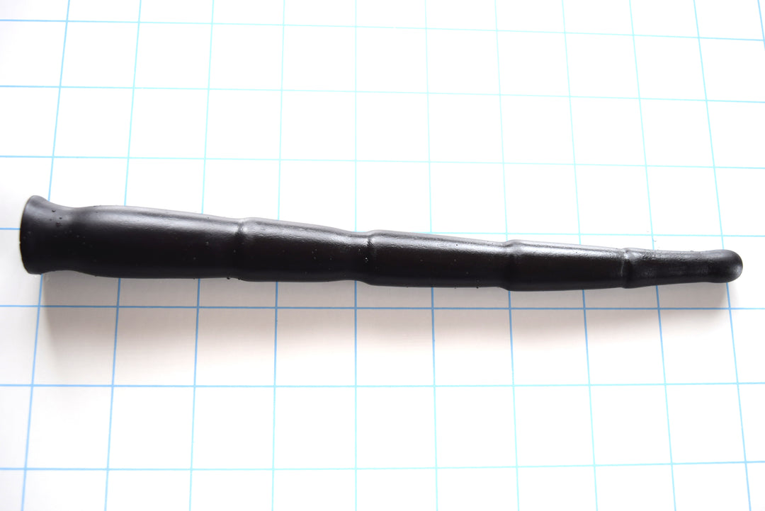 SSND-MD 12-21 multi-diameter black silicone urethral stretching sound shown on a grid background, highlighting its 5 separate progressive segments scaling from an 11mm tip up to a 21mm maximum diameter step, leading to a safety base flange.