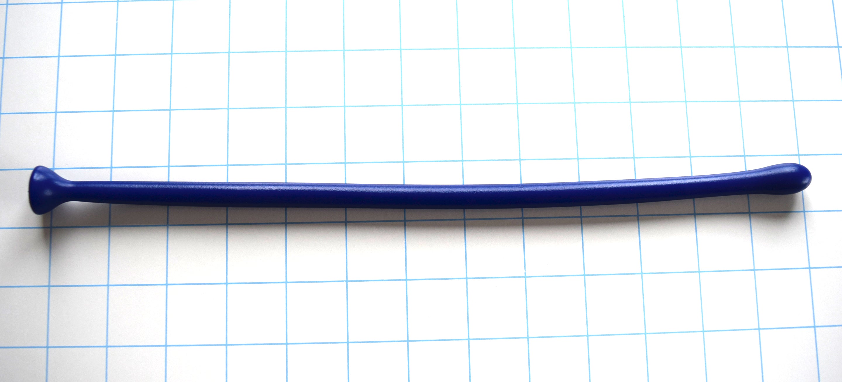 SSND-MGCWAND12 advanced blue silicone urethral sound shown horizontally on a white background with 1"x1" blue grid squares from Screenshot 2026-07-02 162506.jpg, showcasing its 13.6mm bulbous entry tip, 9.8mm slender tracking shaft, 13-inch insertable length, and integrated safety base.