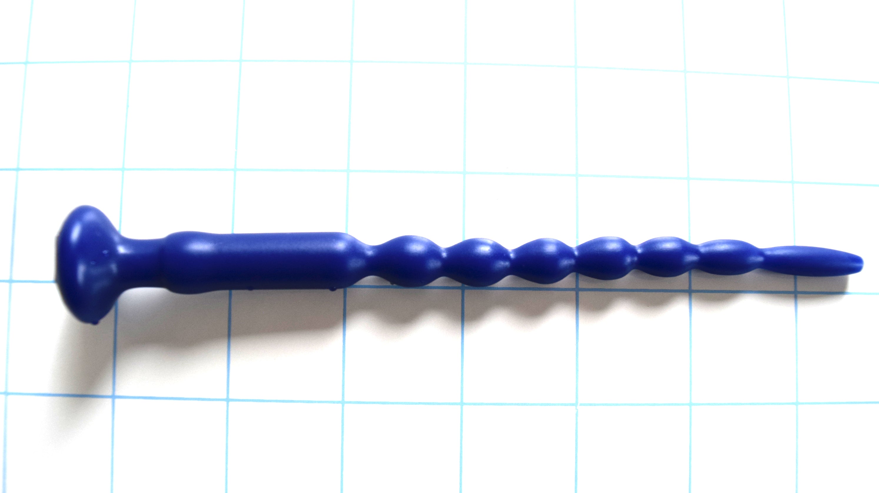 SSND-MRB 7-13 Remix silicone multi-rib urethral sounds in blue displayed on a blue grid background