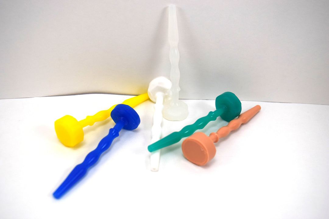SSND-Pierce short-profile silicone urethral sounds displayed in yellow, blue, white, green, and peach color variants, highlighting the four 7.5mm balls, three 5.2mm valleys, 2.4-inch insertable shafts, and integrated flat safety flanges.