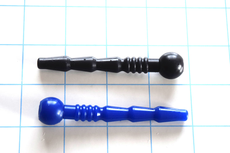 SSND-Quad Rib short silicone catheter plug showing tapered tip, alternating swells, quad ribs, and ball flange in blue and black