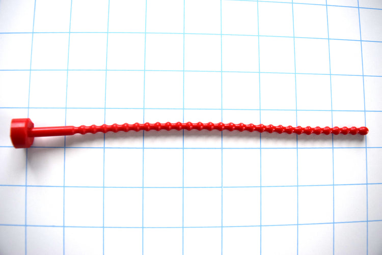 SSND-RIB-6mm soft flexible silicone urethral stretching insert featuring 29 ribbed contours along an 8.5-inch polished shaft, a rounded entry tip, and an integrated safety base flange on a grid background.