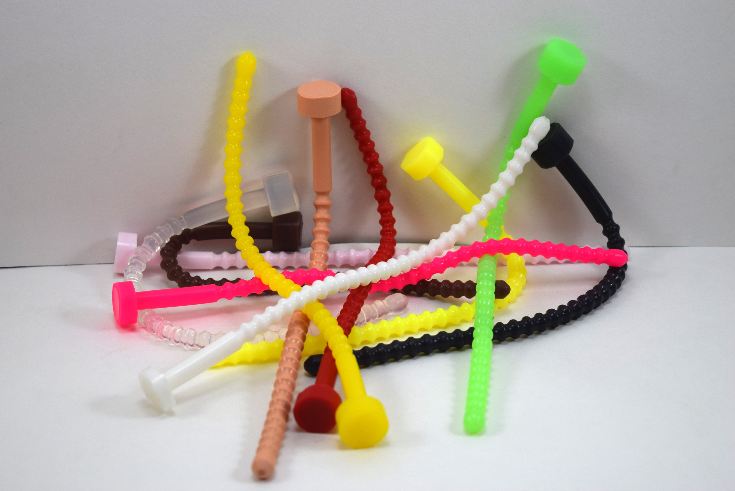 SSND-RIB-8mm ribbed silicone sounds displayed in various colors showing 8mm shaft with 29 rounded ribs, 9 inch length, and flared base.