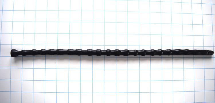 SSND-RNDMBALL 11-14mm extra-large black silicone urethral sound shown horizontally on a white background with 1"x1" blue grid squares from Screenshot 2026-07-02 141616.jpg, showcasing its 22 massive multi-size nodes peaking at 14mm, 16.5-inch insertable length, and integrated safety base flange