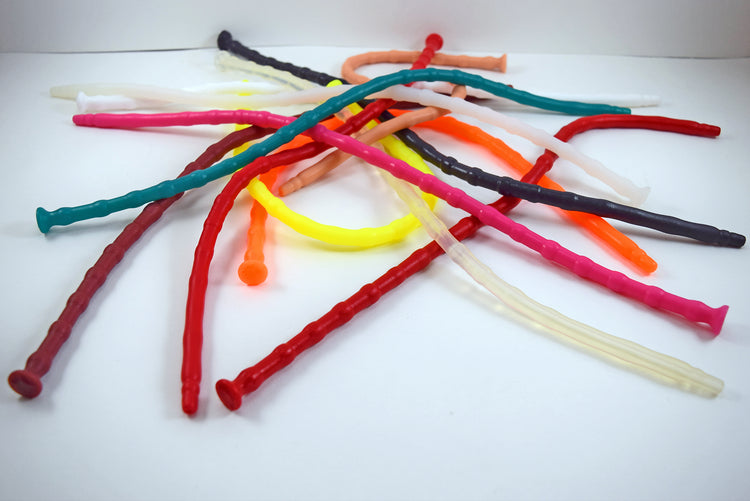 A large pile of SSND-RNDMBALL 7-10mm ribbed silicone sounds displayed in an assortment of vibrant colors including teal, red, yellow, pink, orange, and clear.