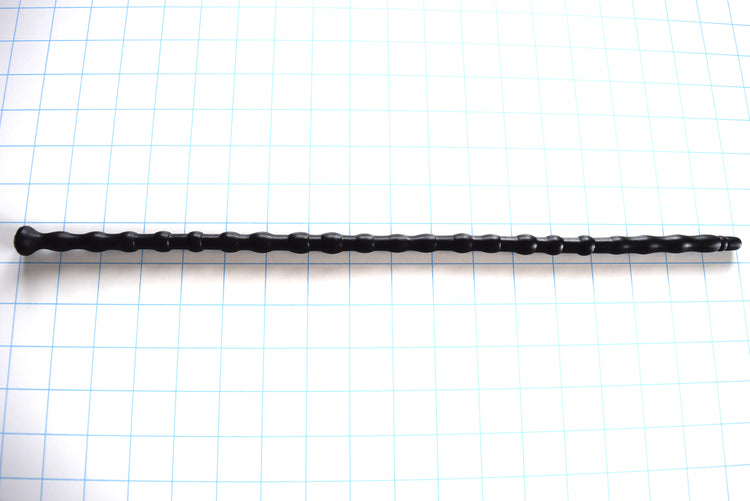 SSND-RNDMBALL 9-12.5 extra-long black silicone urethral sound shown horizontally on a white background with 1"x1" blue grid squares from Screenshot 2026-07-02 140857.jpg, highlighting its 22 distinct spherical and tapered nodes peaking at 12.7mm, 16.5-inch insertable length, and flat safety base flange