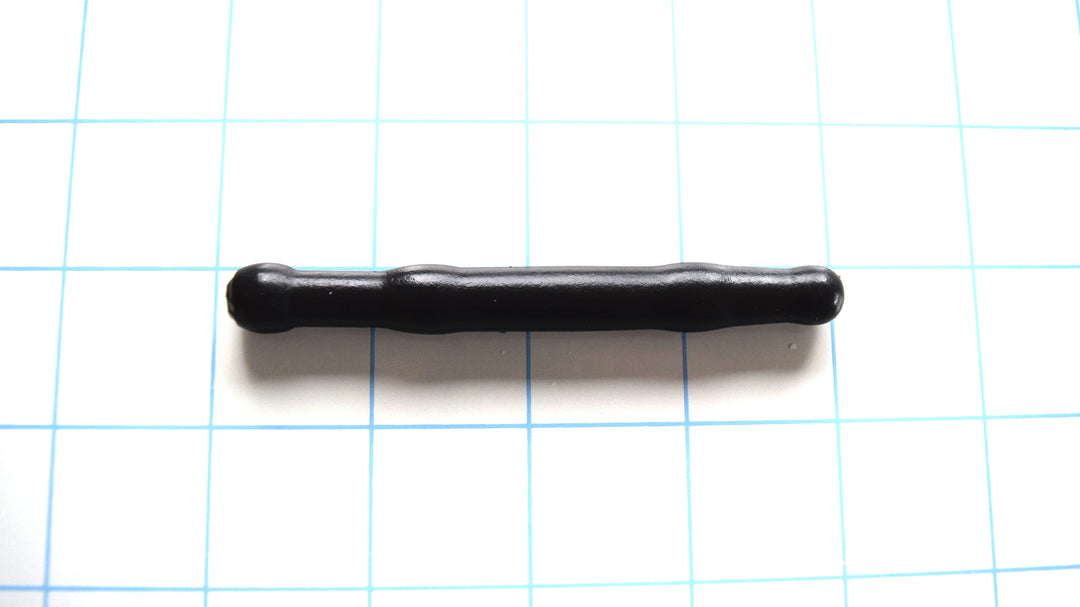 SSND-SHRTCATH 11mm short-profile black silicone urethral sound resting on a blue grid background, showcasing its 9.5mm rounded tip, 11mm double-ball sealing nodes, and 8.8mm retention valley
