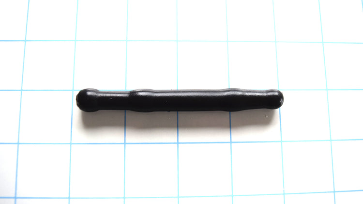 SSND-SHRTCATH 11mm short-profile black silicone urethral sound resting on a blue grid background, showcasing its 9.5mm rounded tip, 11mm double-ball sealing nodes, and 8.8mm retention valley