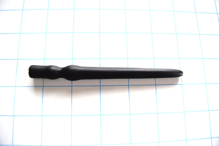 SSND-SHRTCATH 5 7 14 advanced flangeless black silicone urethral sound plug shown horizontally on a grid background from Screenshot 2026-07-02 104204.jpg, highlighting its 6mm to 12mm tapered shaft, prominent 14mm retention ball, 9mm sphincter valley, and final 12mm flangeless grip swell